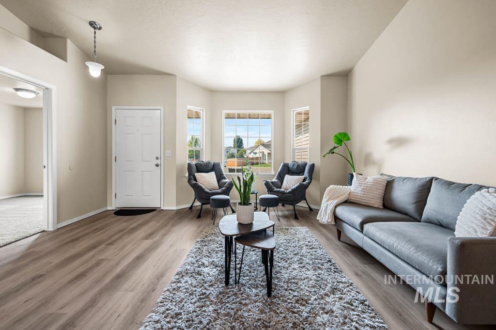 Living room featuring light wood-style flooring