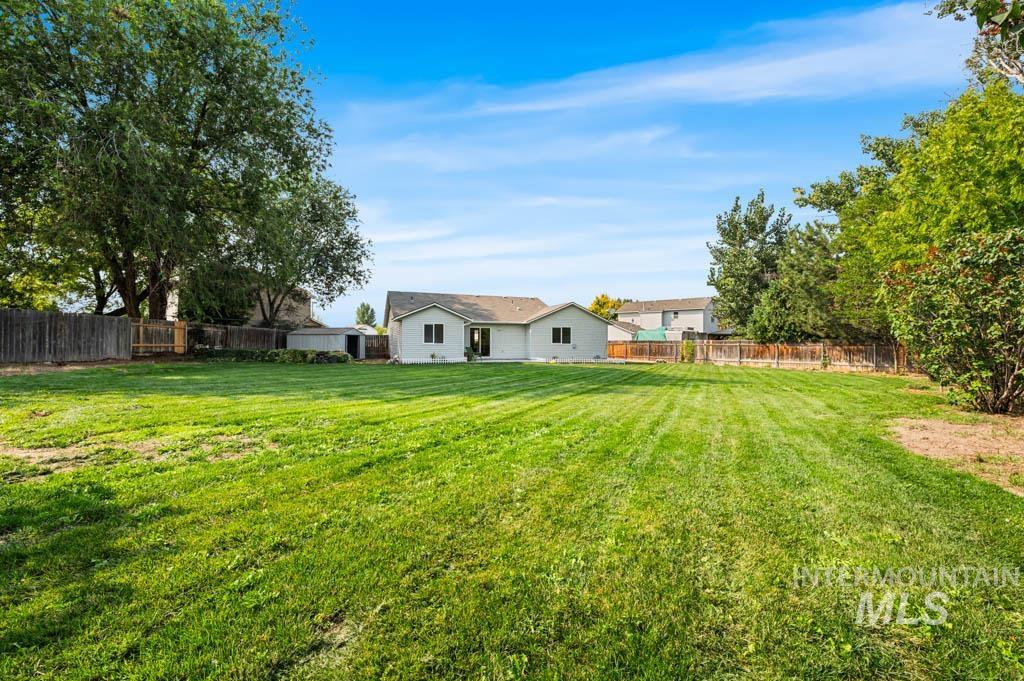 View of fenced backyard