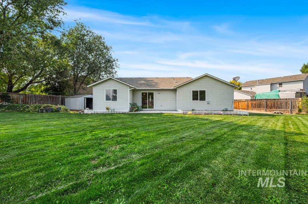 Rear view of house featuring a patio