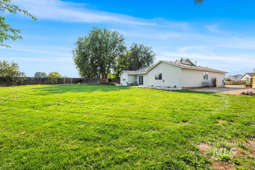 Fenced backyard with a patio
