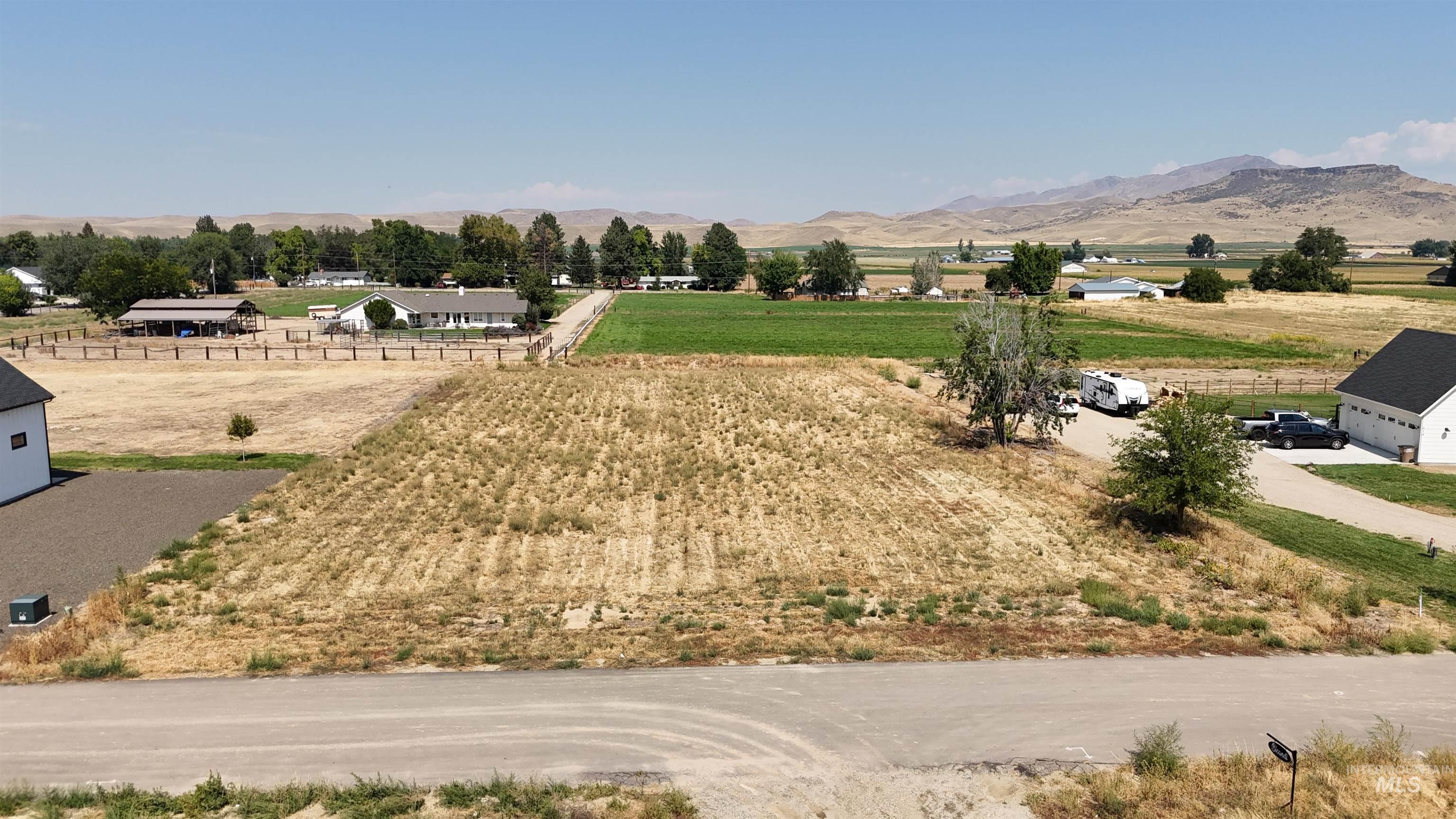 Aerial view of sparsely populated area with a mountainous background