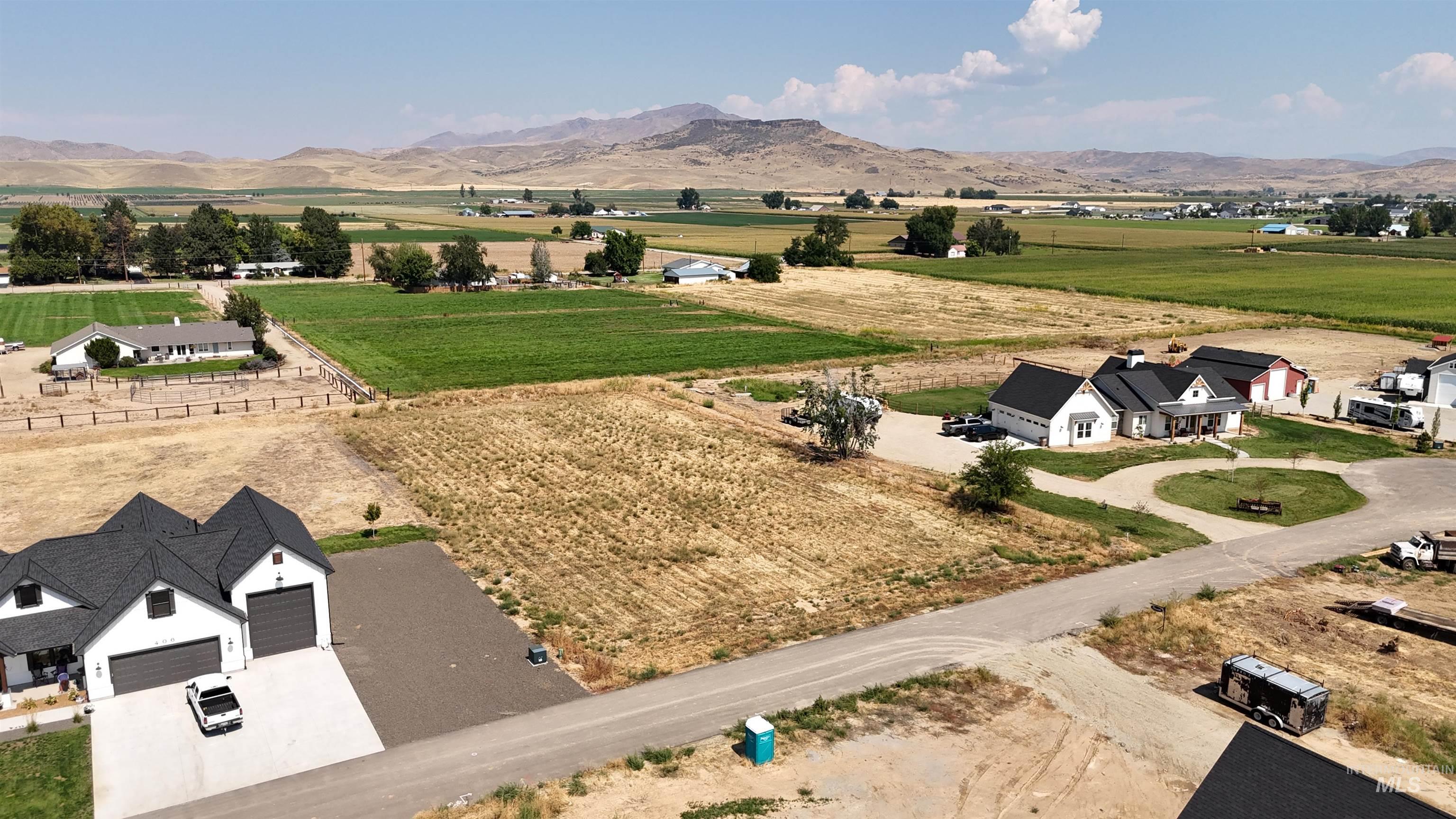 Overview of rural landscape featuring a mountainous background