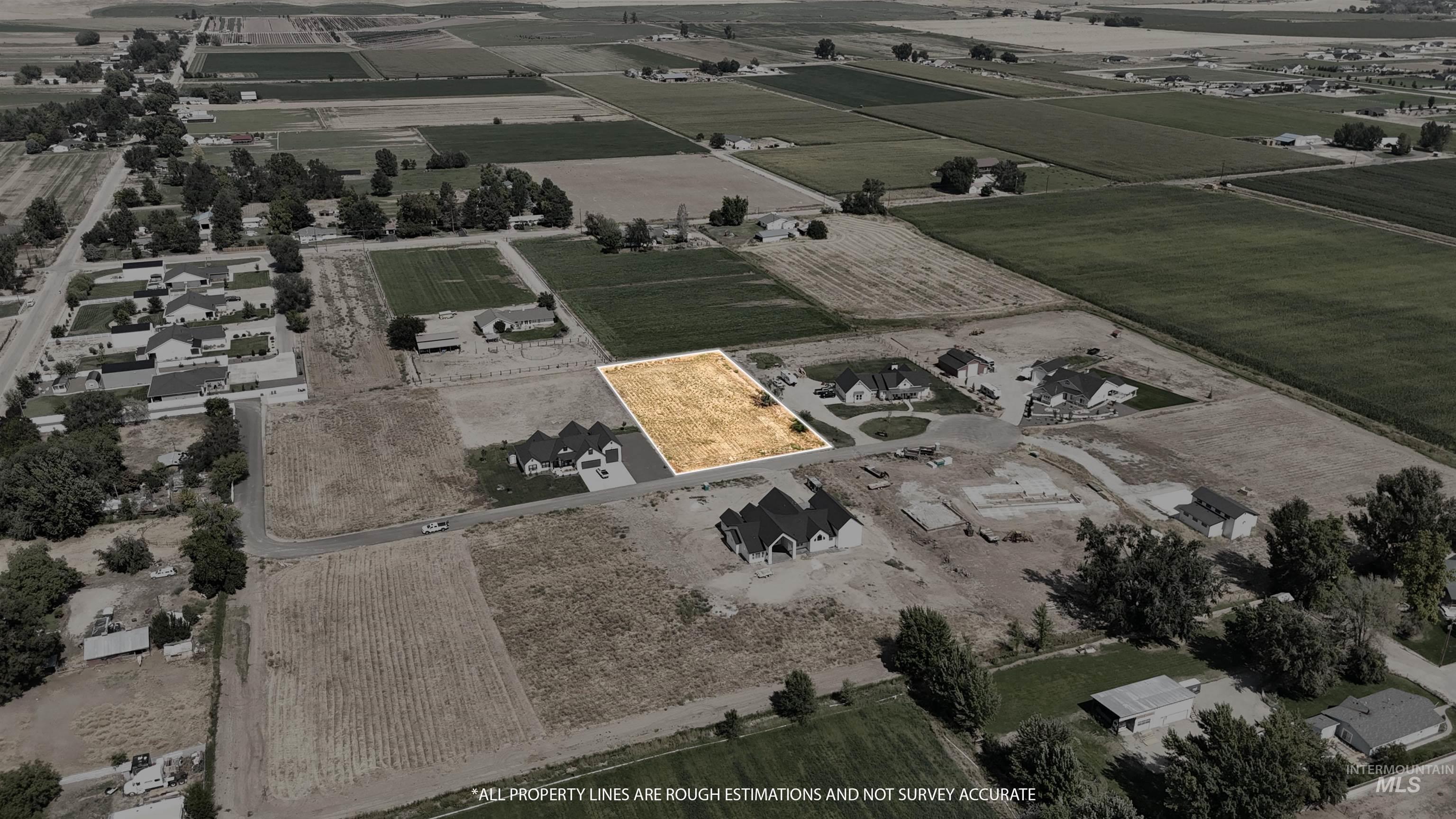 Aerial overview of property's location with property boundaries highlighted and rural landscape