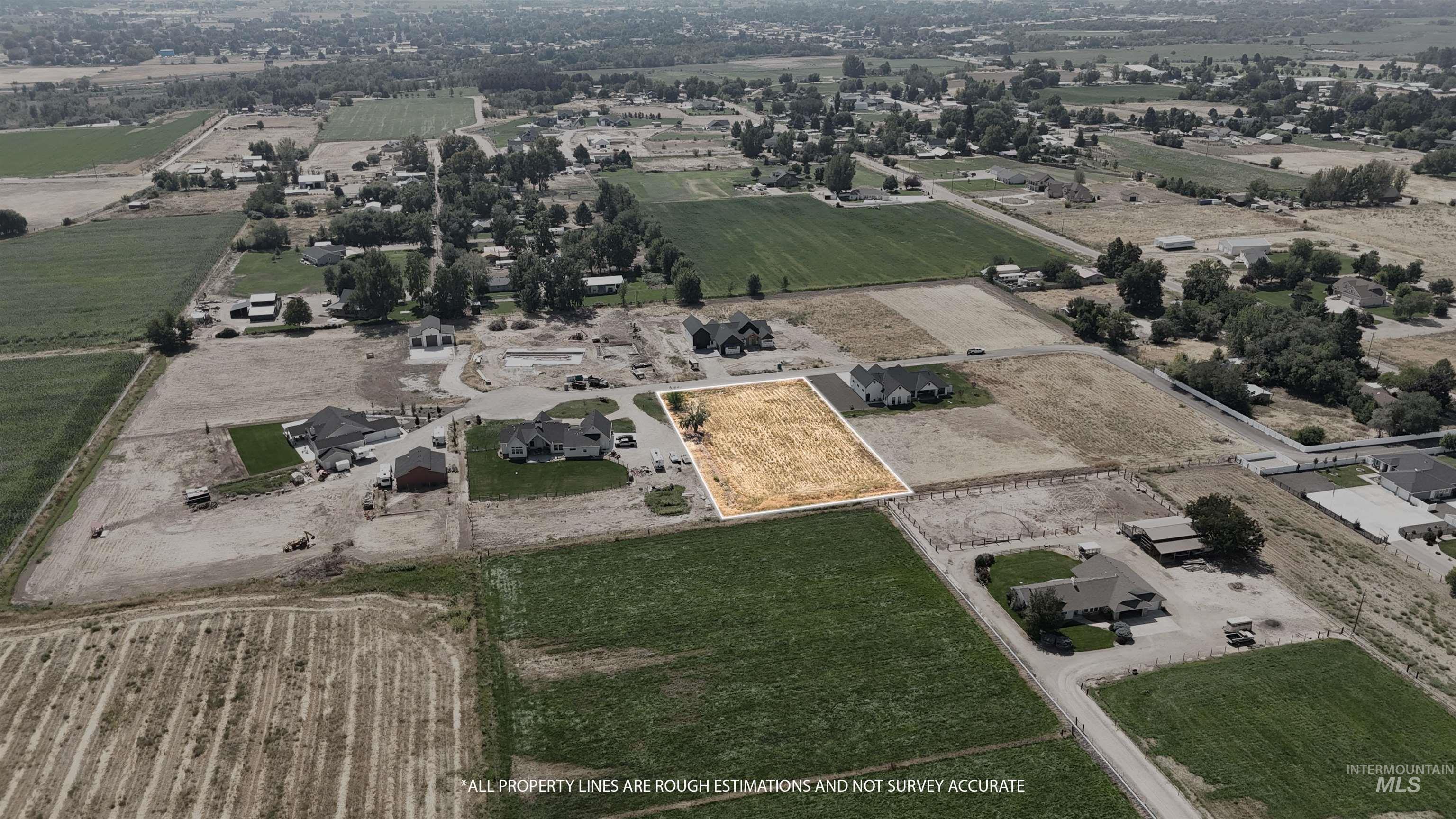 Aerial view of property and surrounding area featuring rural landscape and abundant farmland