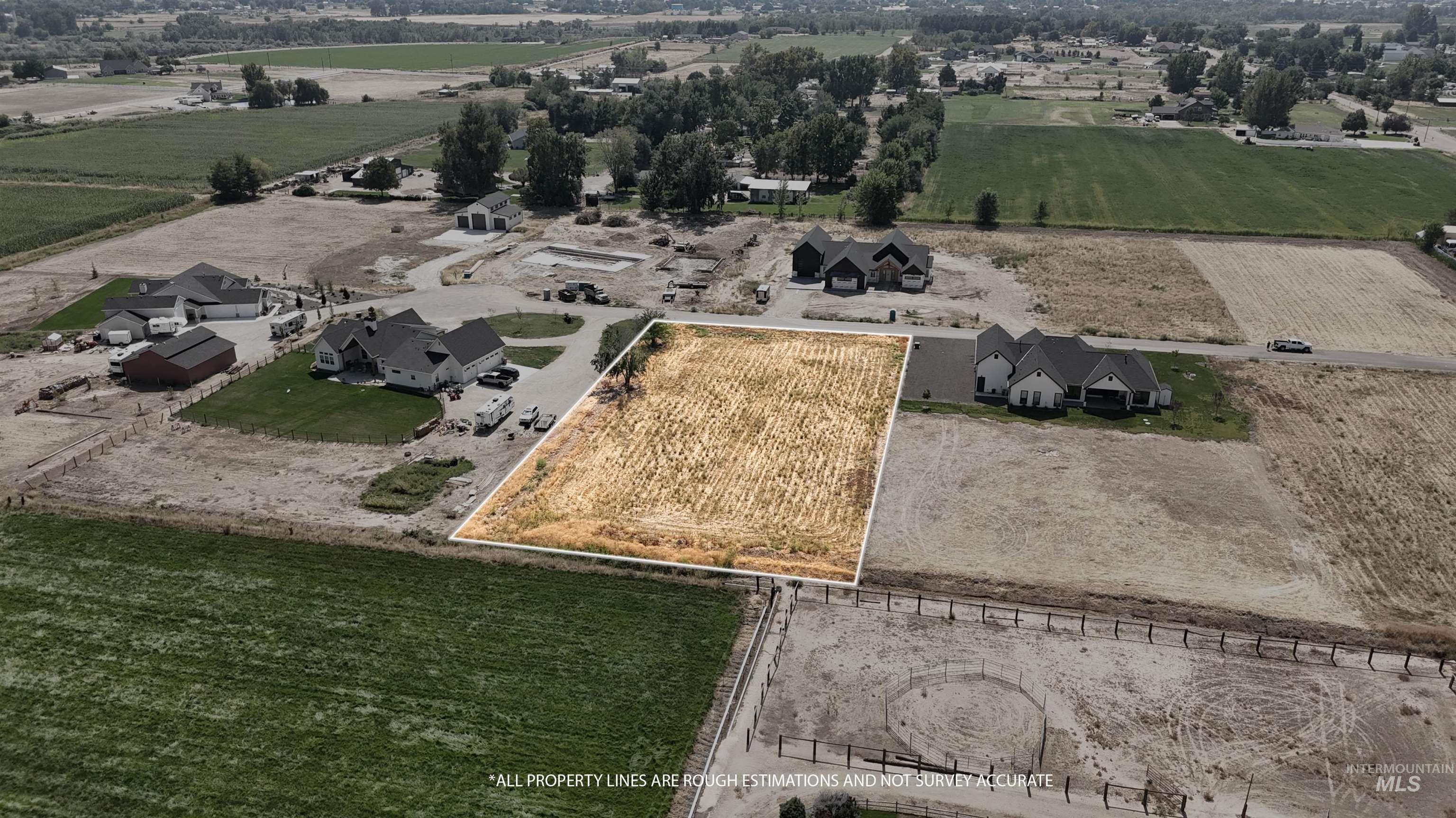 Aerial view of sparsely populated area featuring property boundaries highlighted