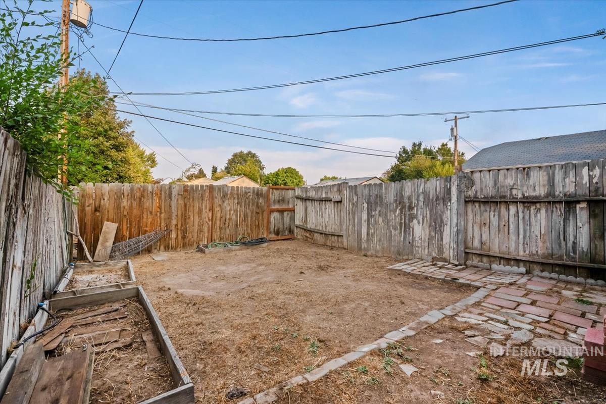Fenced backyard featuring a patio area