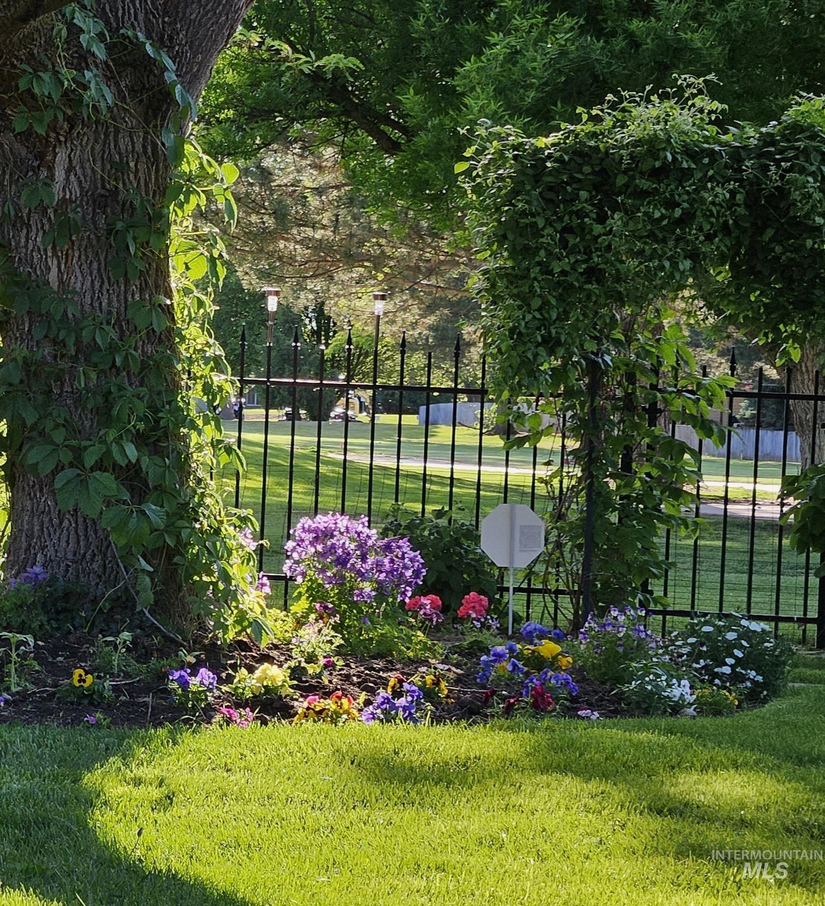 Entertainment with open and covered patios, and a wrought iron gate to the 14th hole. Freshly landscaped.