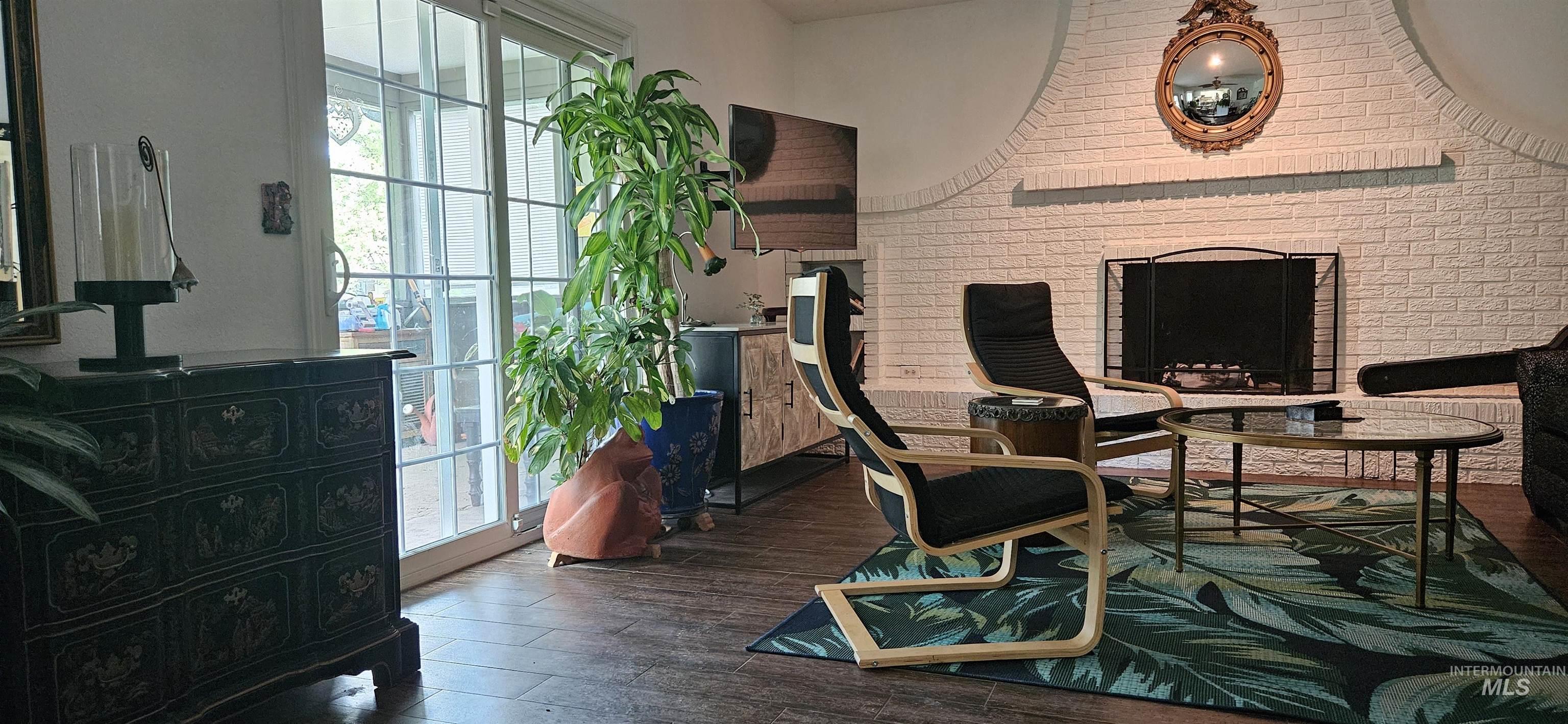 Park Like view of yard and course..floor to ceiling wall to wall hearth fireplace, tiled 