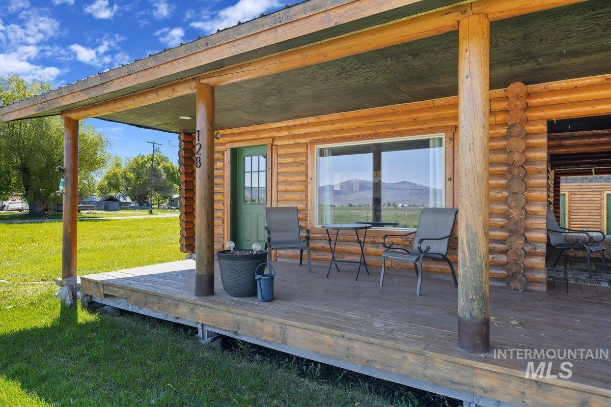 Deck featuring a yard and outdoor dining space
