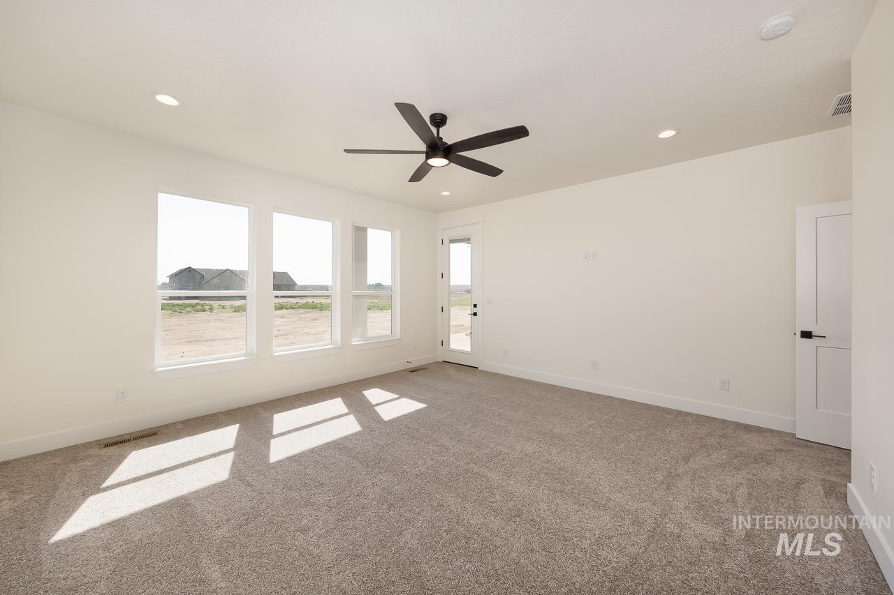 Unfurnished room with light colored carpet, recessed lighting, and ceiling fan