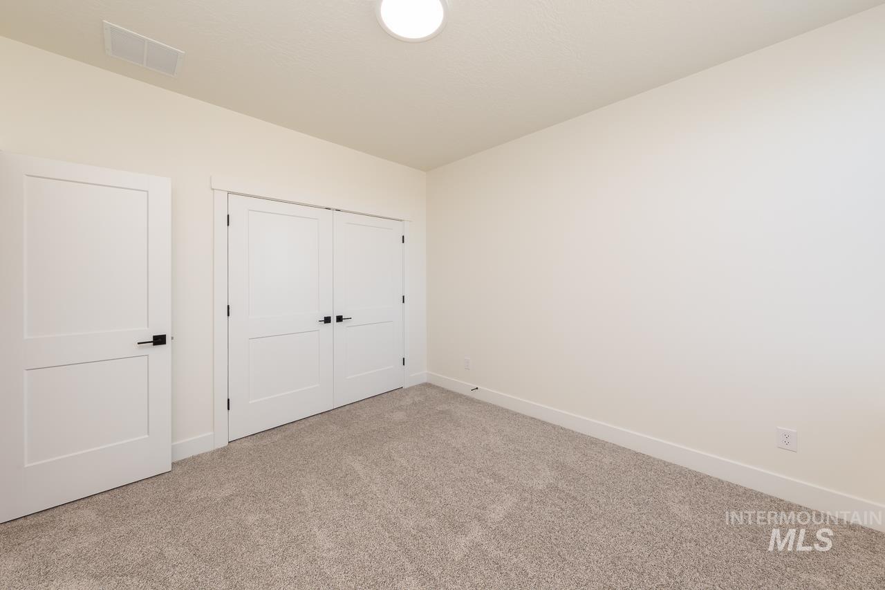 Unfurnished bedroom with carpet floors and a closet