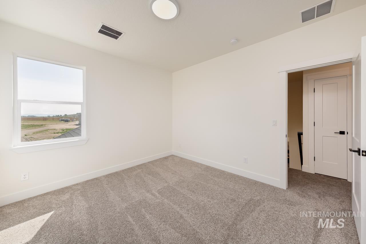 Empty room with carpet flooring