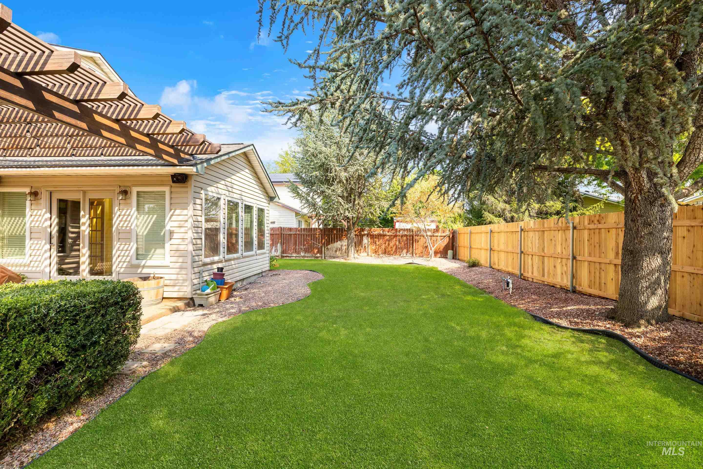 View of fenced backyard