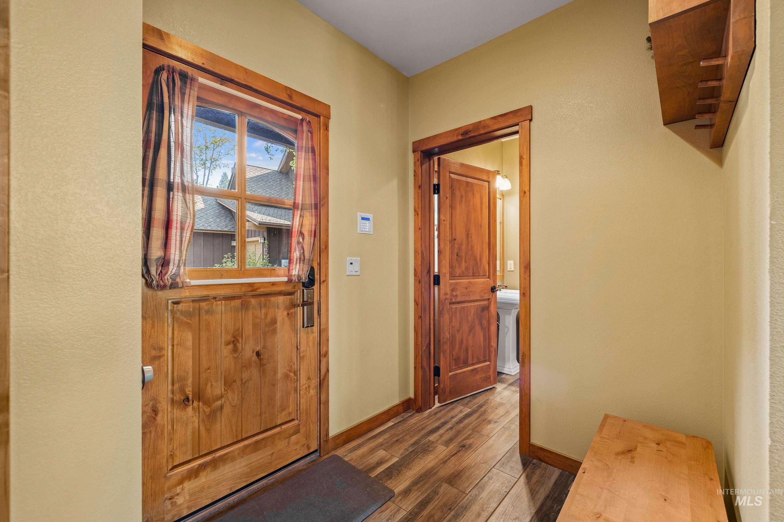 Doorway to outside and powder room entrance