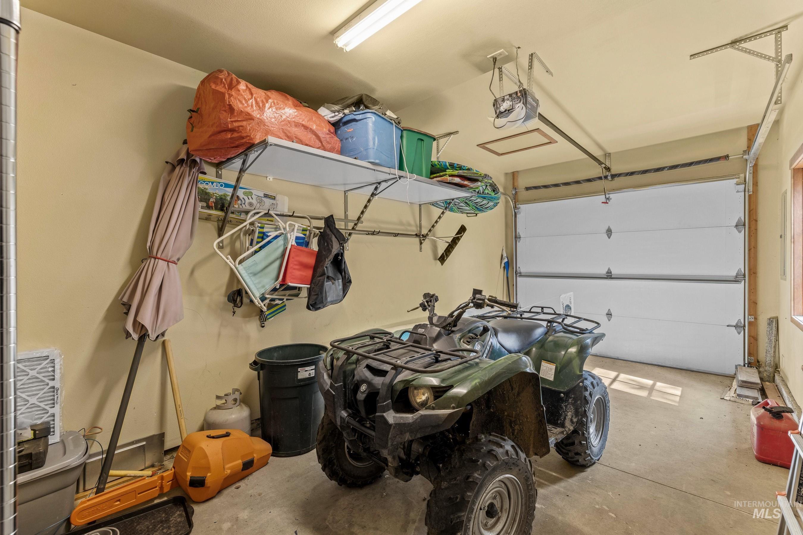 Garage featuring a garage door opener
