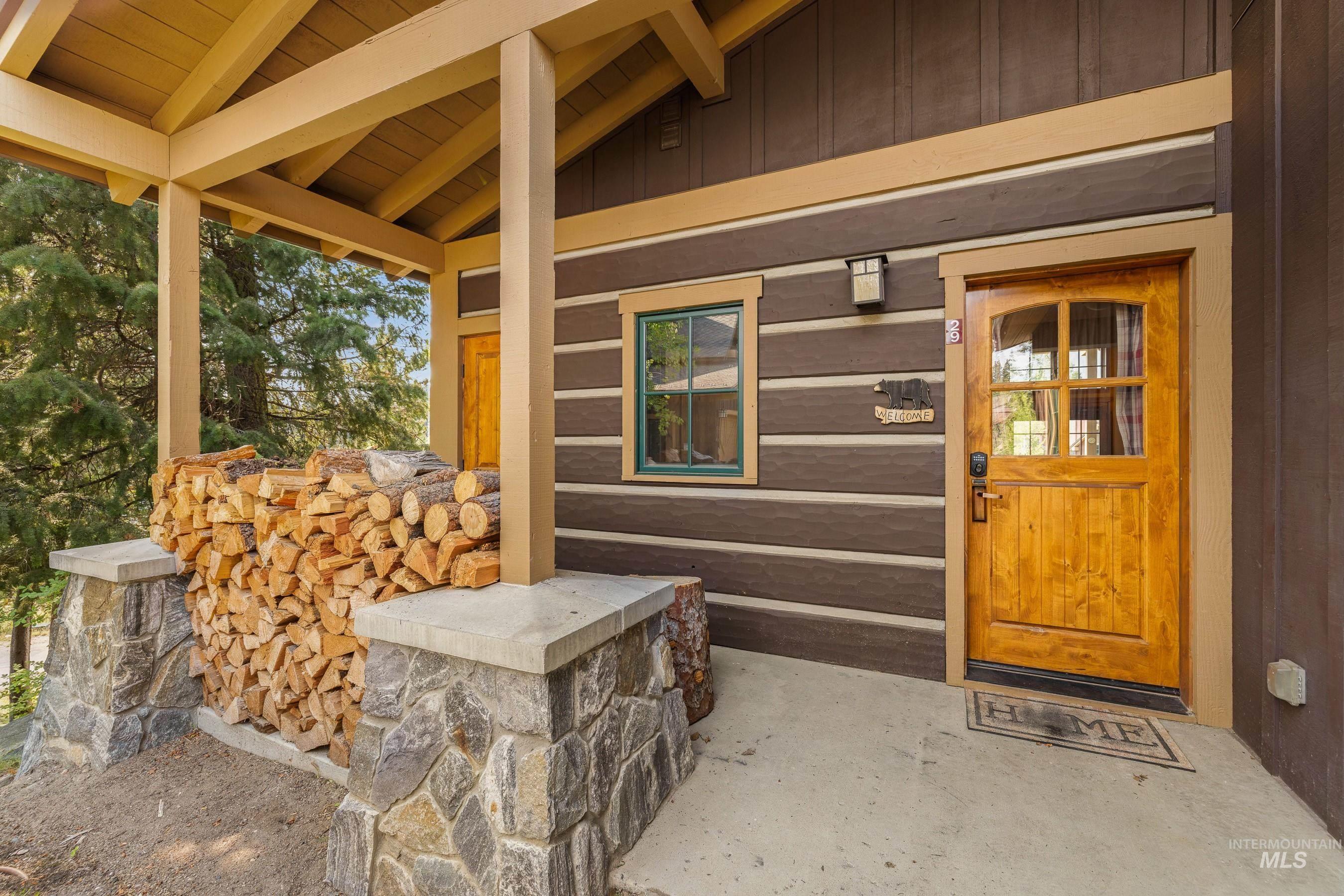 Doorway to property with covered porch