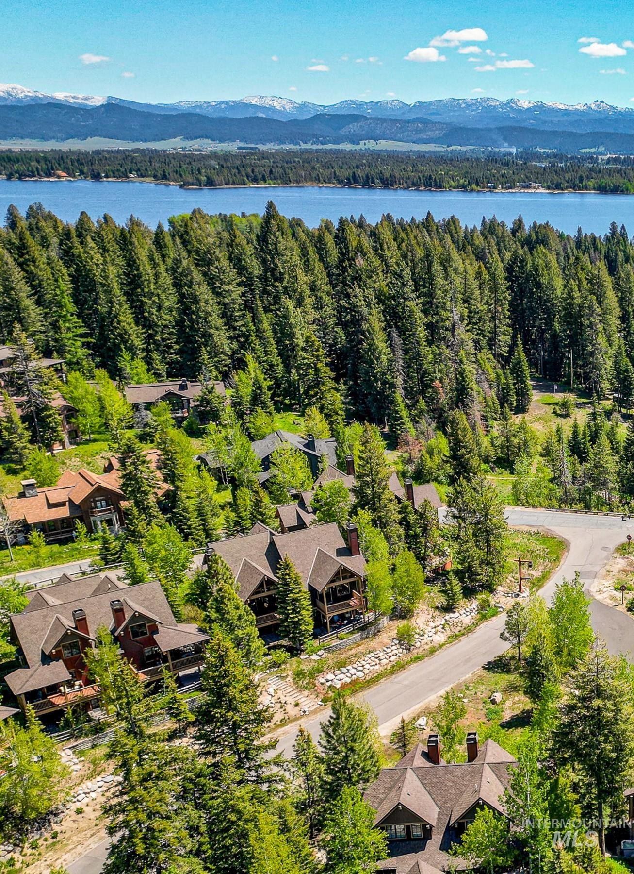 Aerial view of residential area featuring a mountainous background