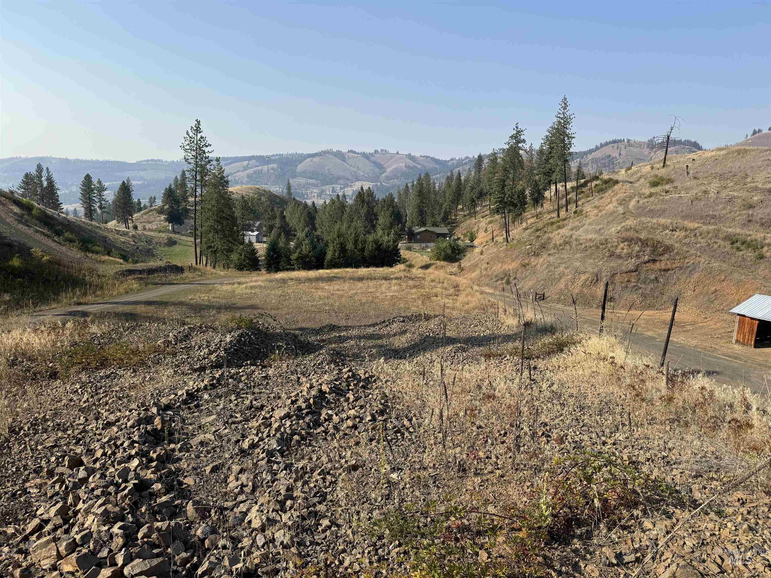 View of mountain backdrop featuring rural landscape