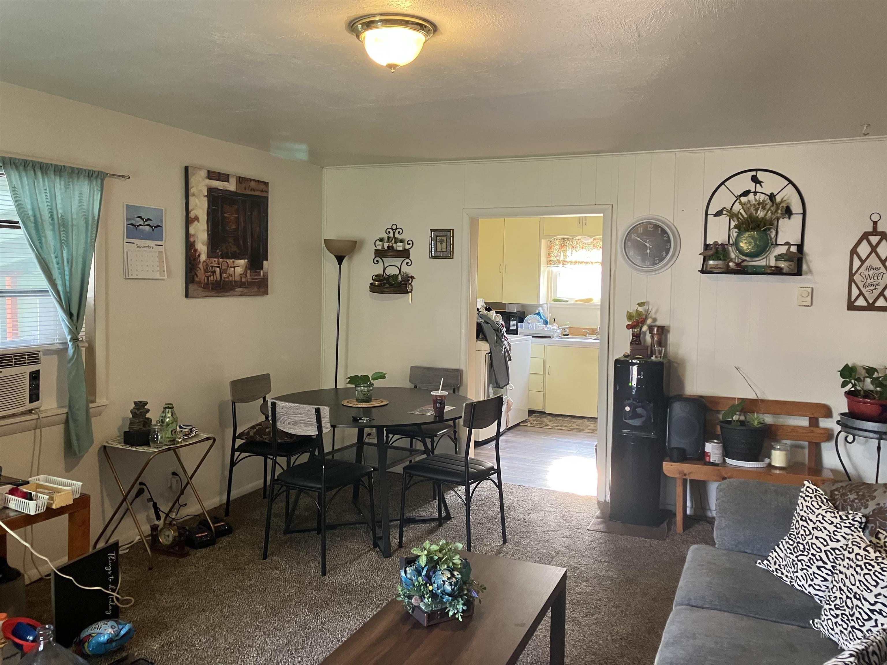 Living area featuring washer and clothes dryer and cooling unit