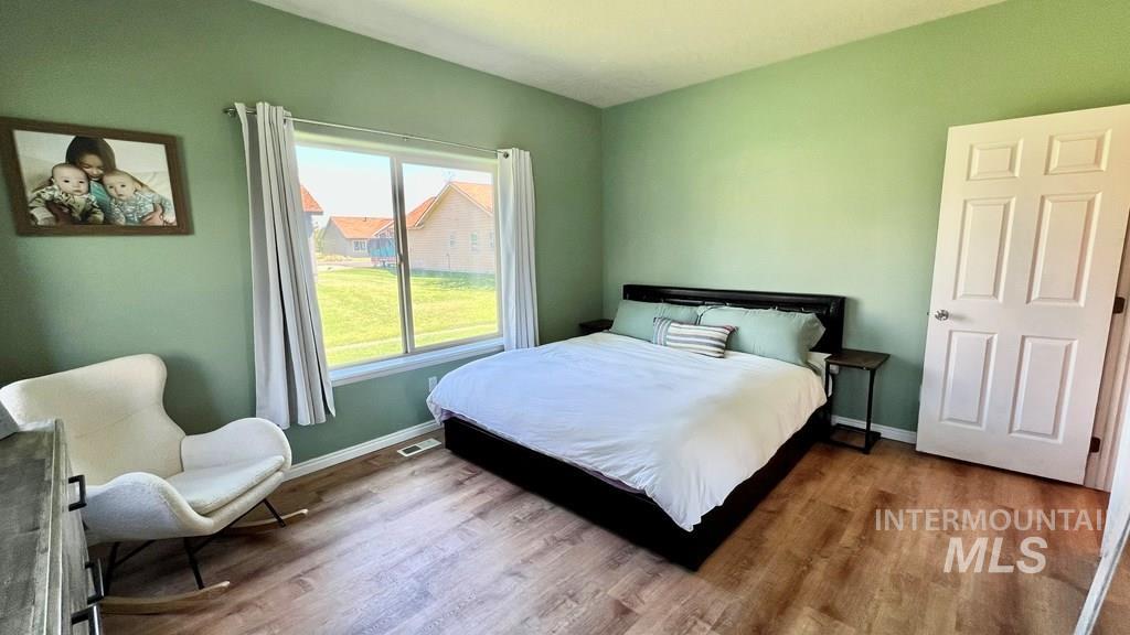 Bedroom with wood finished floors