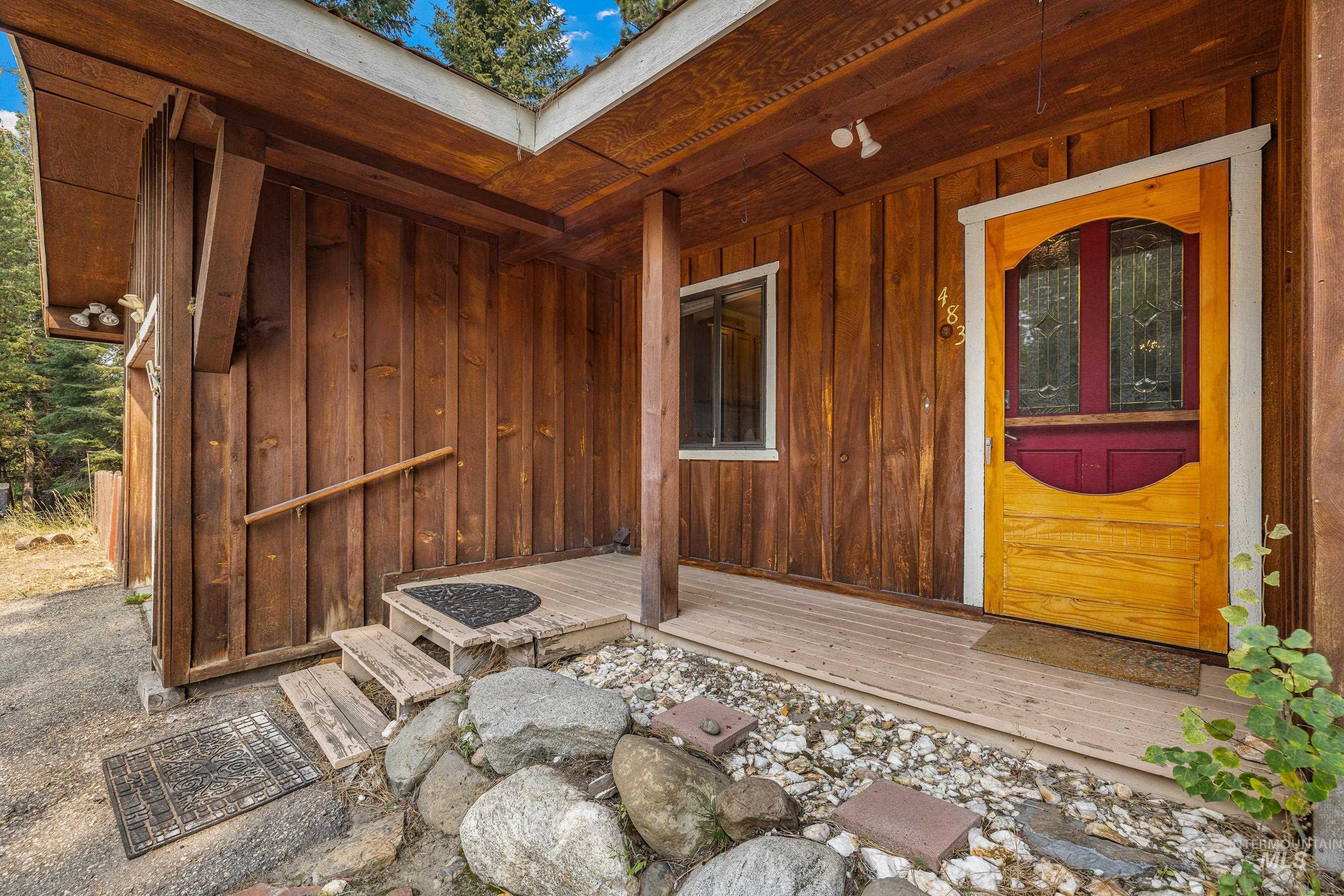 Doorway to property with board and batten siding