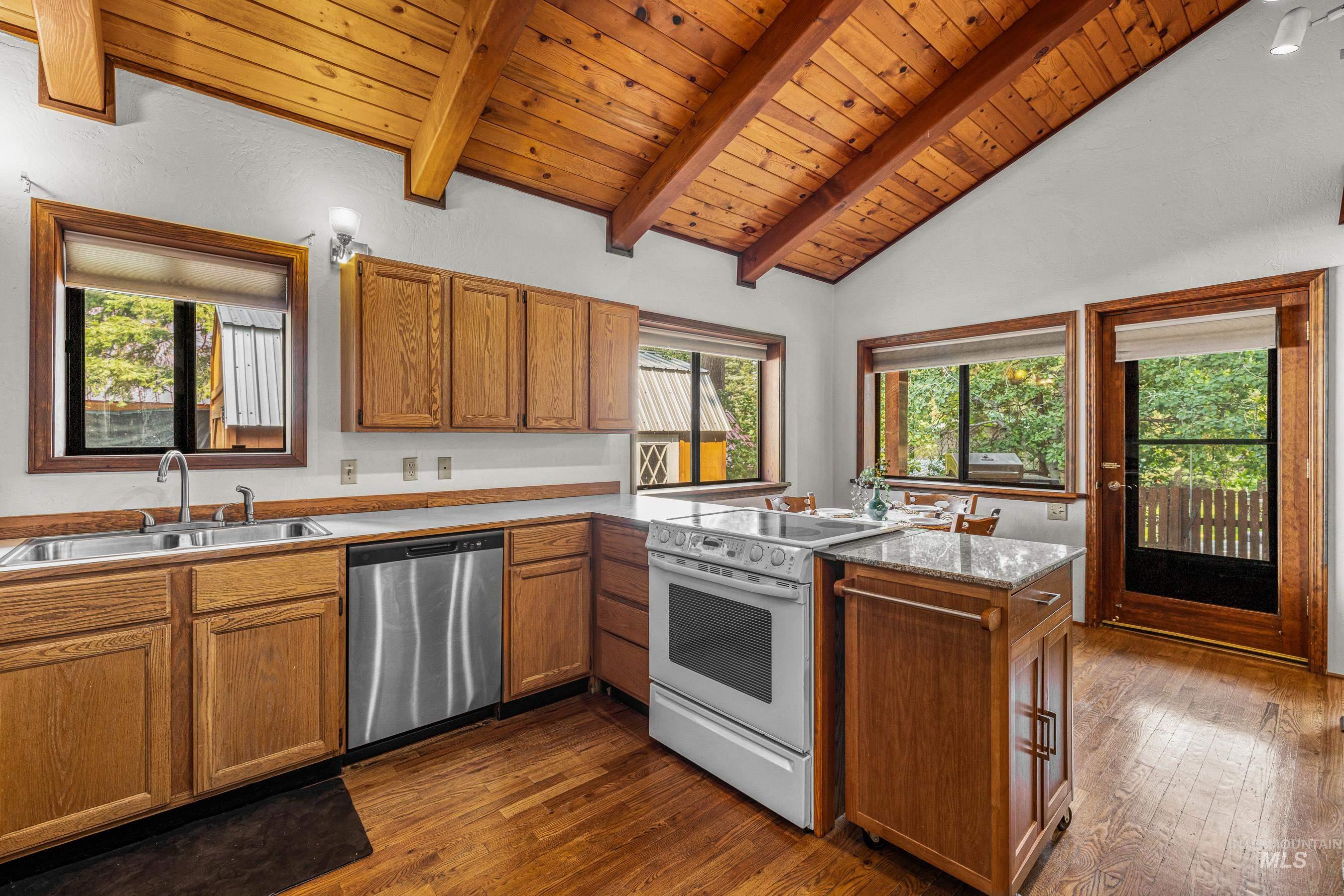 Kitchen featuring white range with electric stovetop, wooden ceiling, stainless steel dishwasher, dark wood-type flooring, and brown cabinets