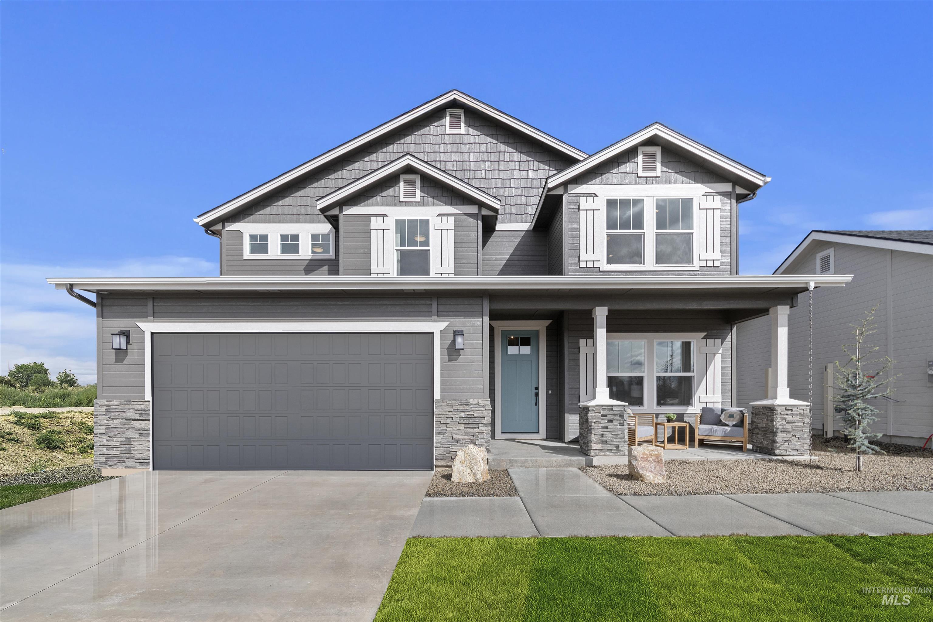 Craftsman-style house with stone siding, a porch, a garage, and concrete driveway