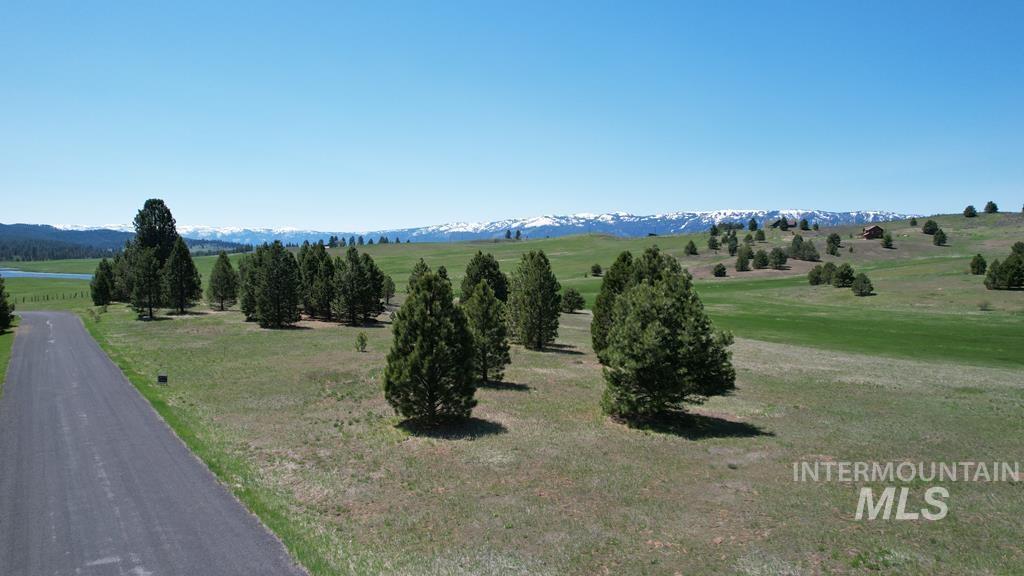 View of mountain backdrop with rural landscape