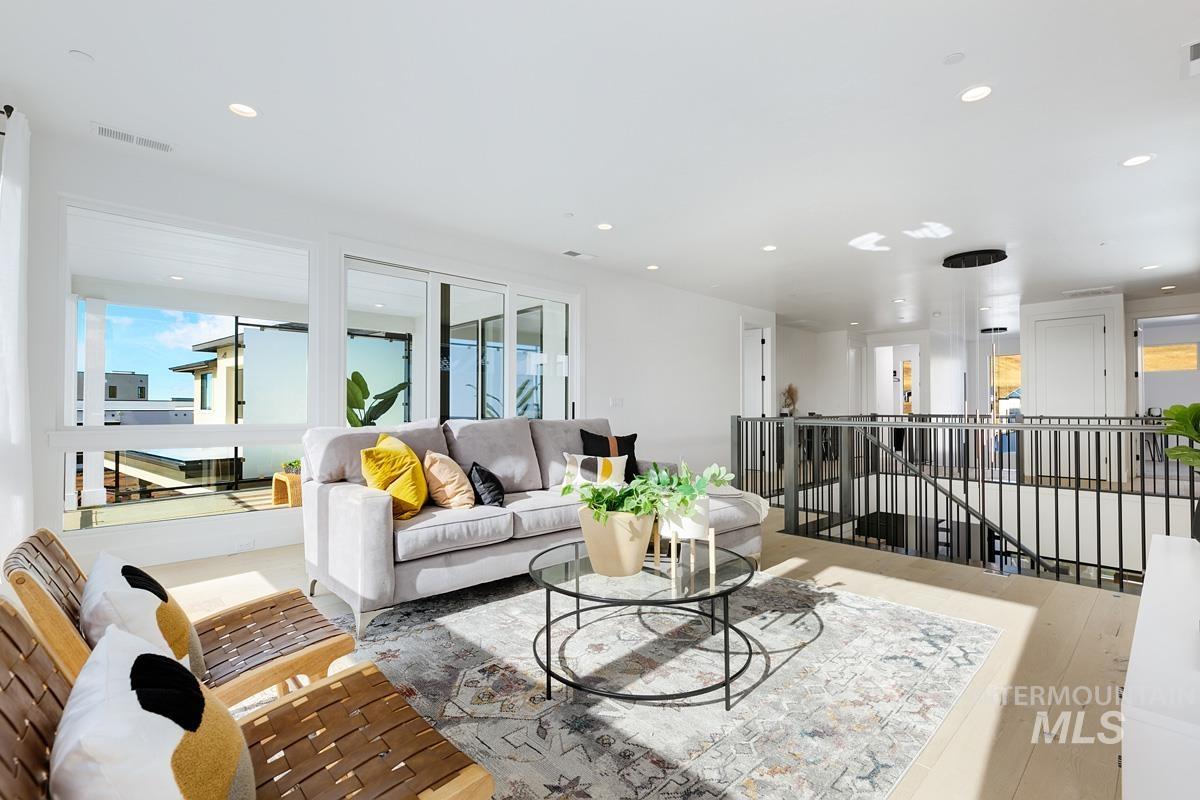 Living area featuring recessed lighting and wood finished floors