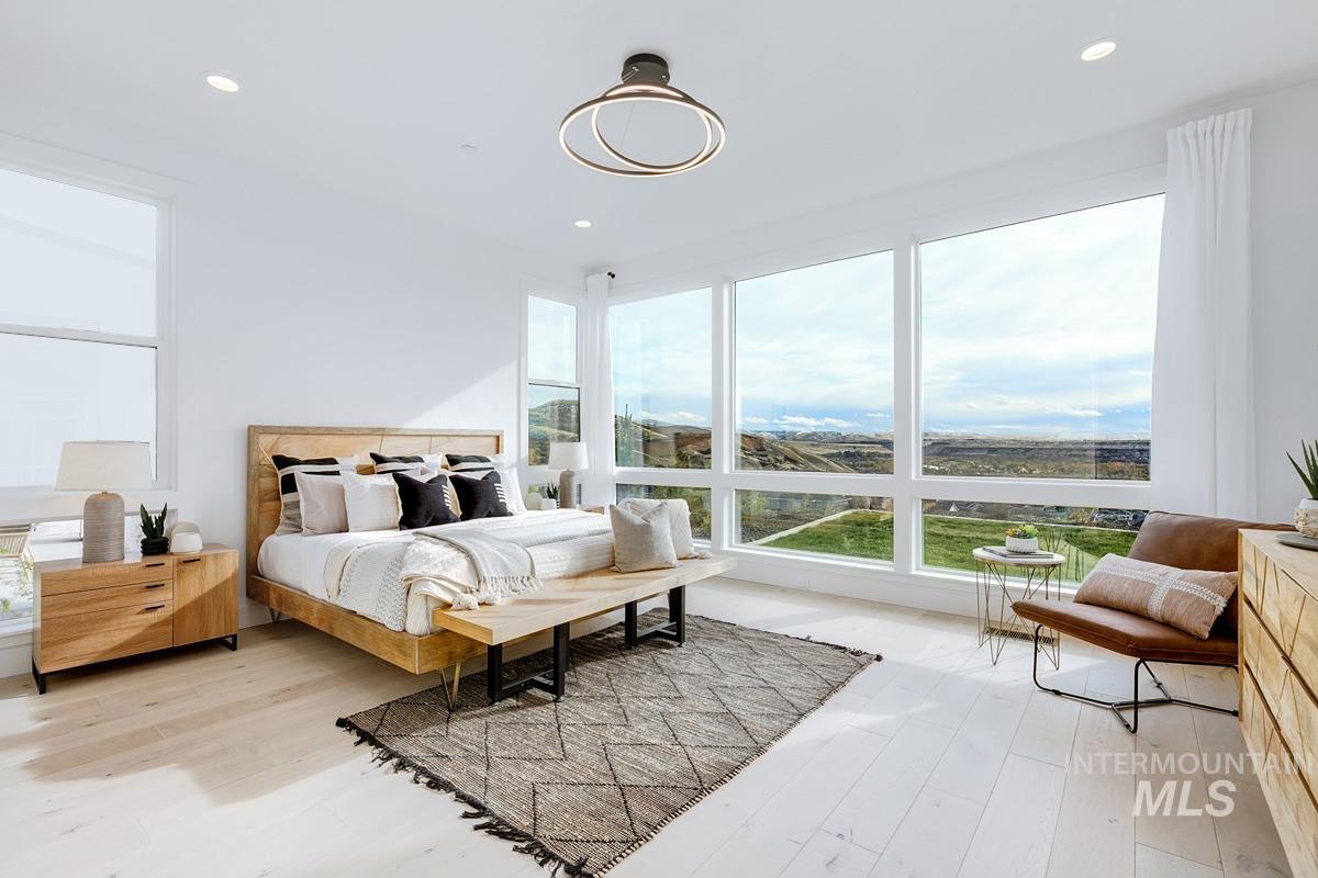Bedroom with light wood-type flooring and recessed lighting