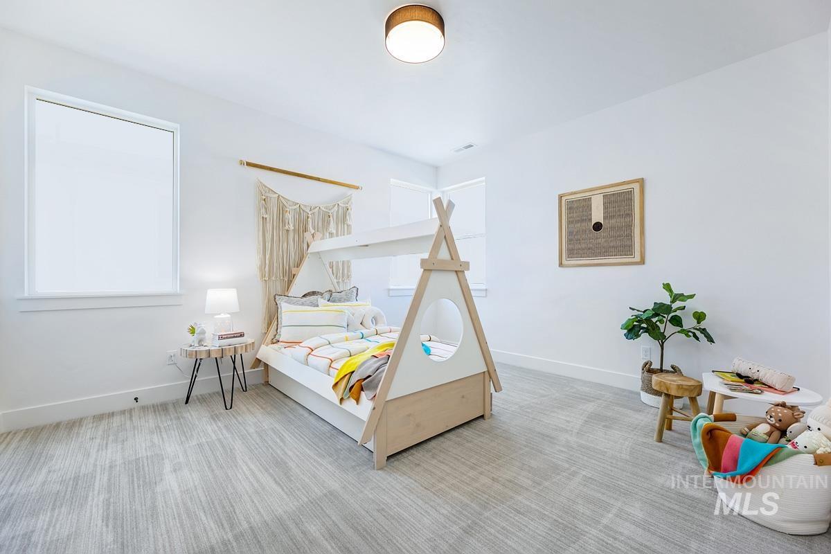 Bedroom with carpet and baseboards