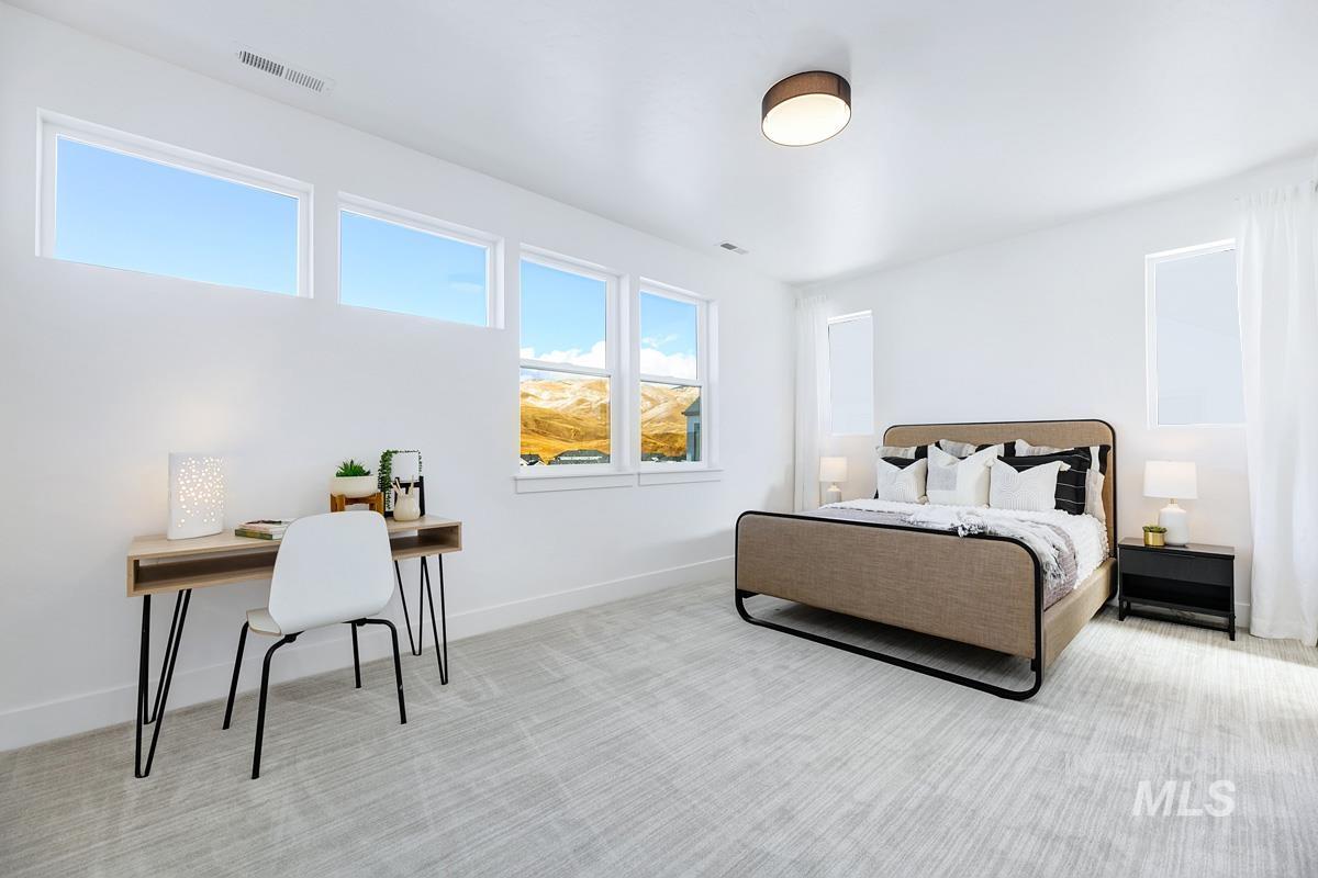 Carpeted bedroom featuring baseboards