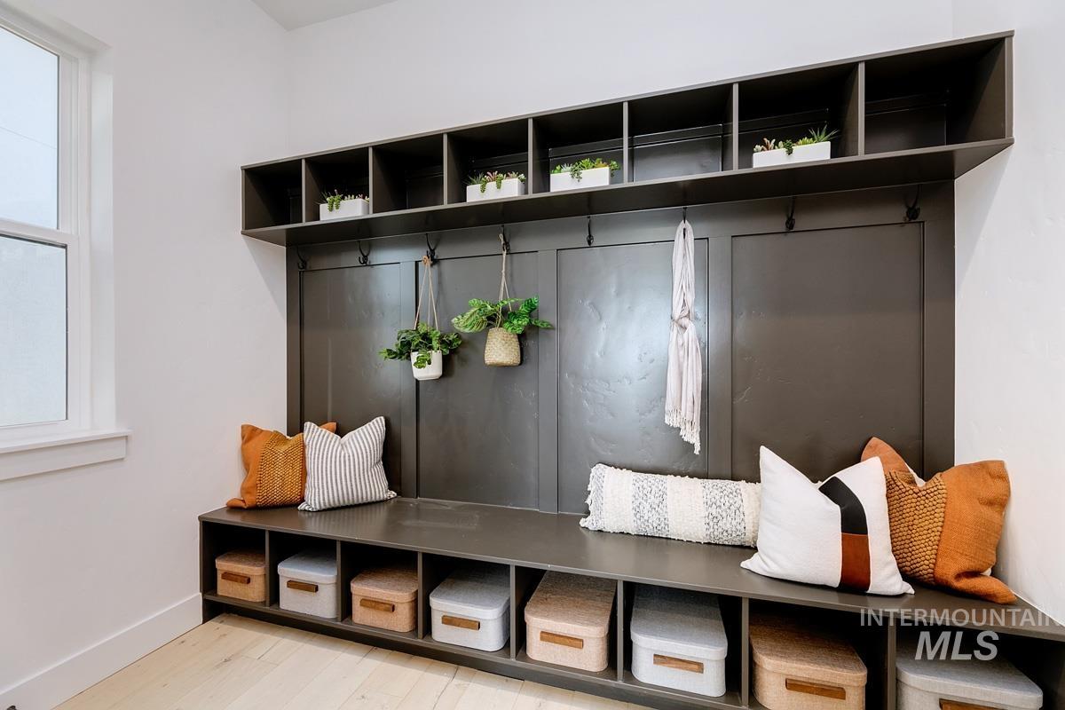 Mudroom with baseboards and light wood finished floors