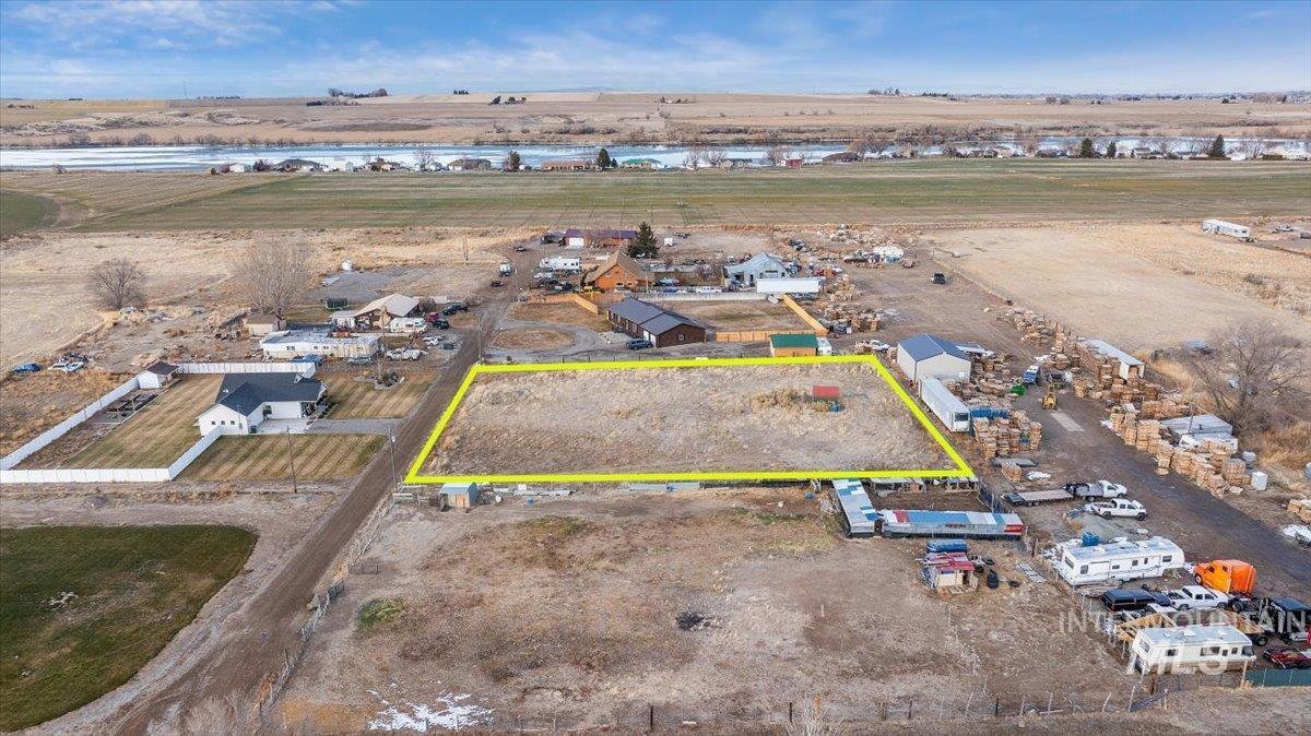 View of rural area featuring property parcel outlined and a large body of water