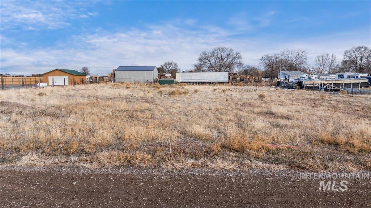 View of yard with a view of rural / pastoral area and an outbuilding