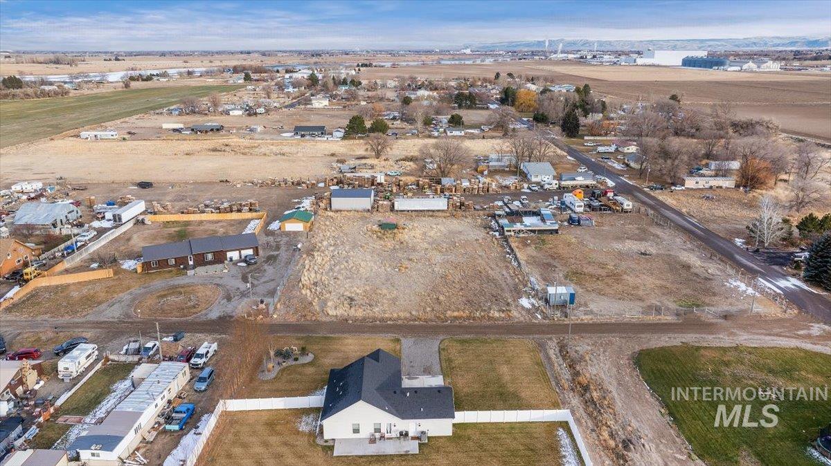 Aerial view of property and surrounding area with rural landscape