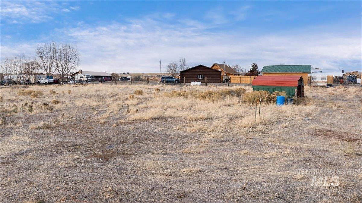View of yard with a view of countryside and an outdoor structure