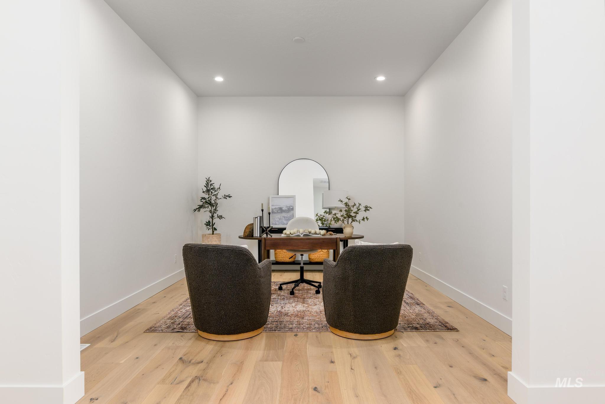 Sitting room featuring a desk, light wood finished floors, and recessed lighting