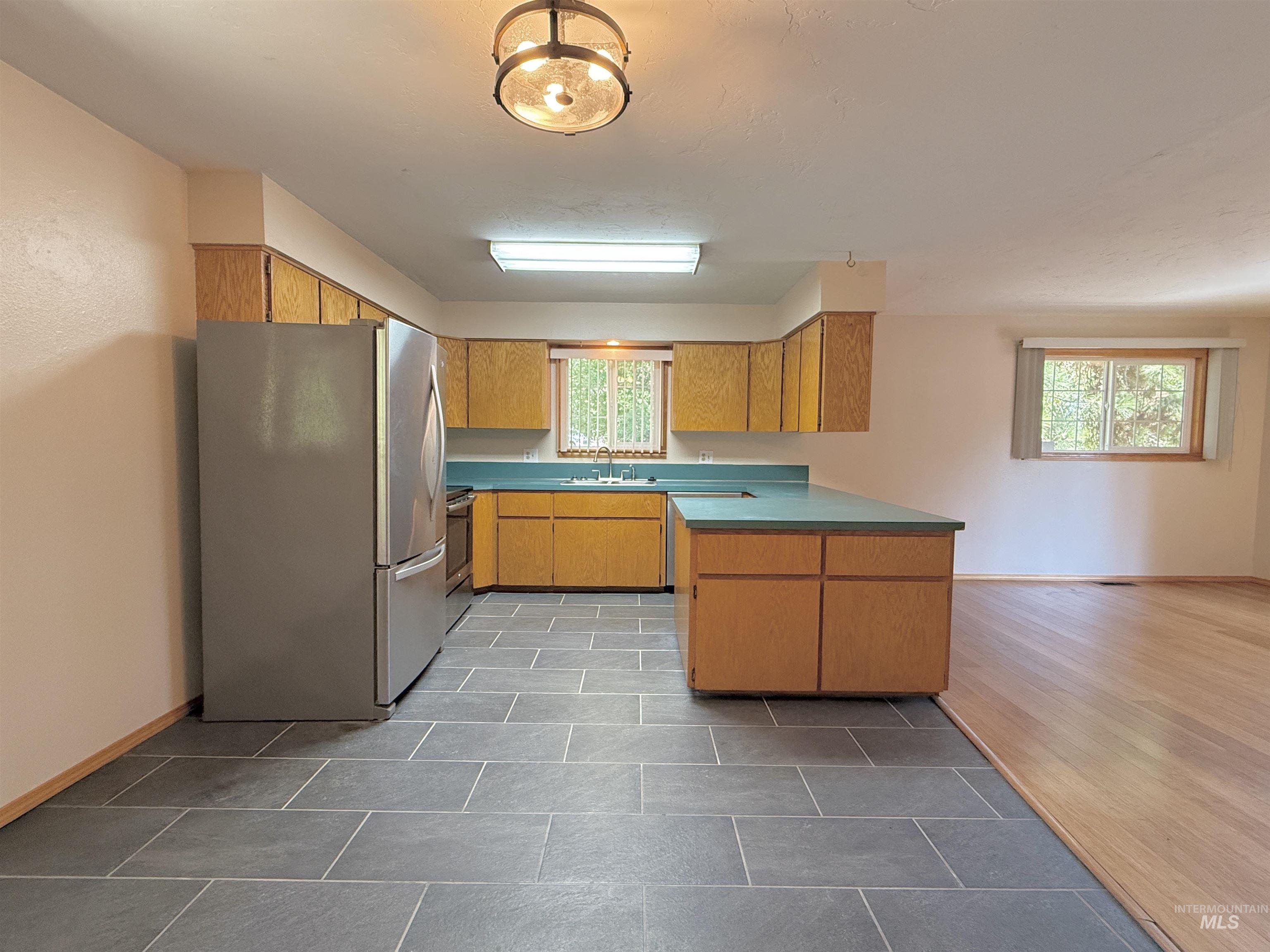 Kitchen featuring stainless steel appliances and a peninsula