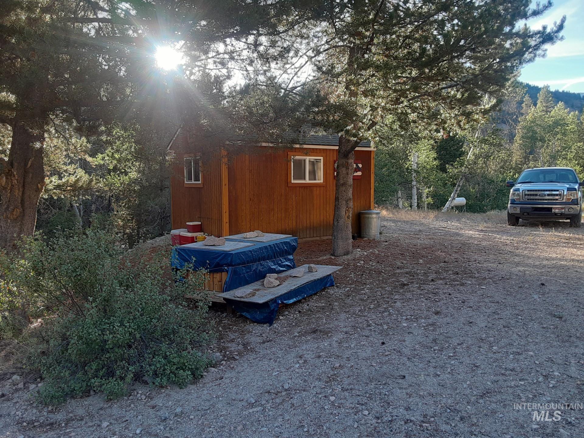View of outbuilding featuring a wooded view
