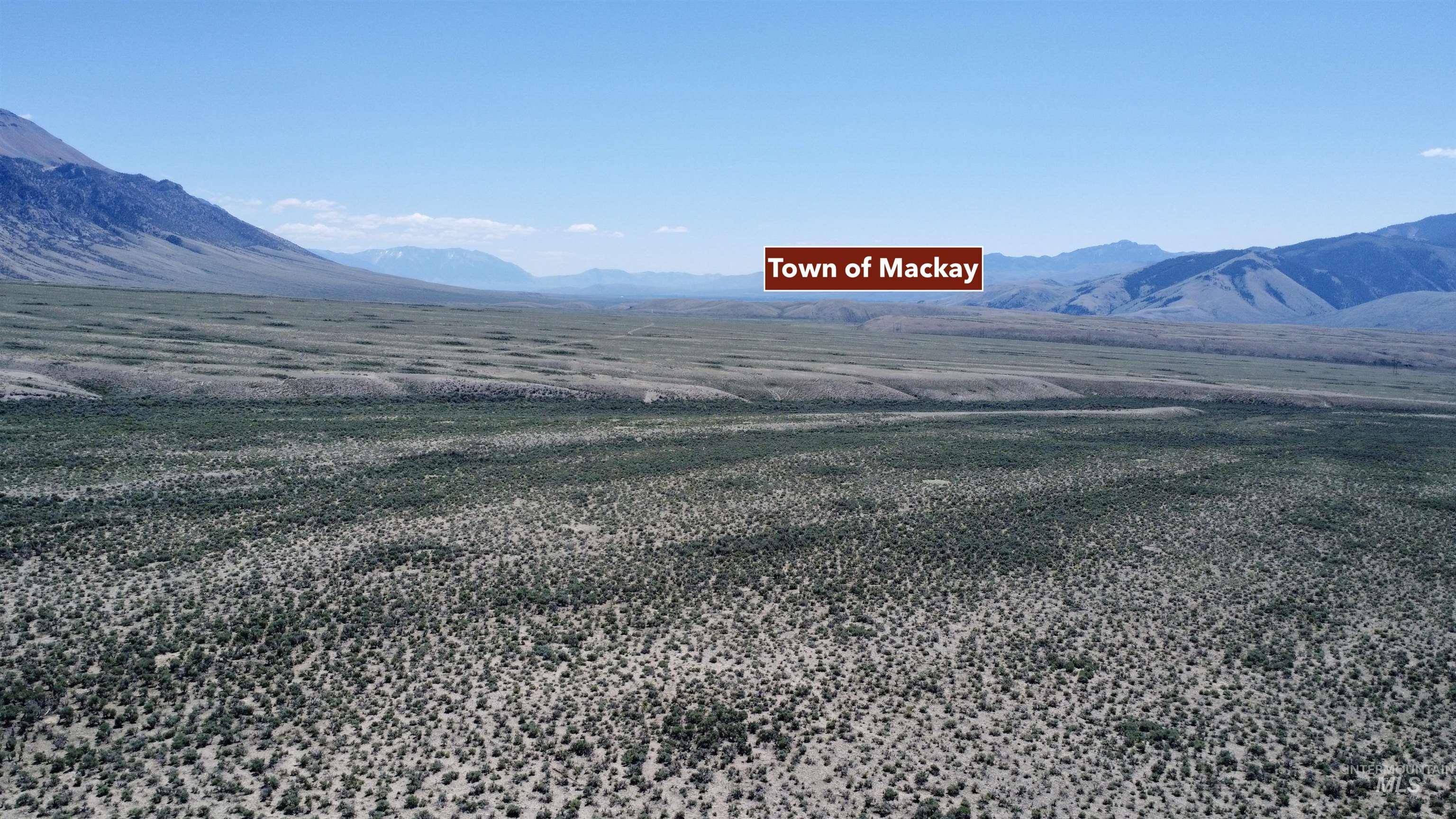 View of mountain background featuring rural landscape