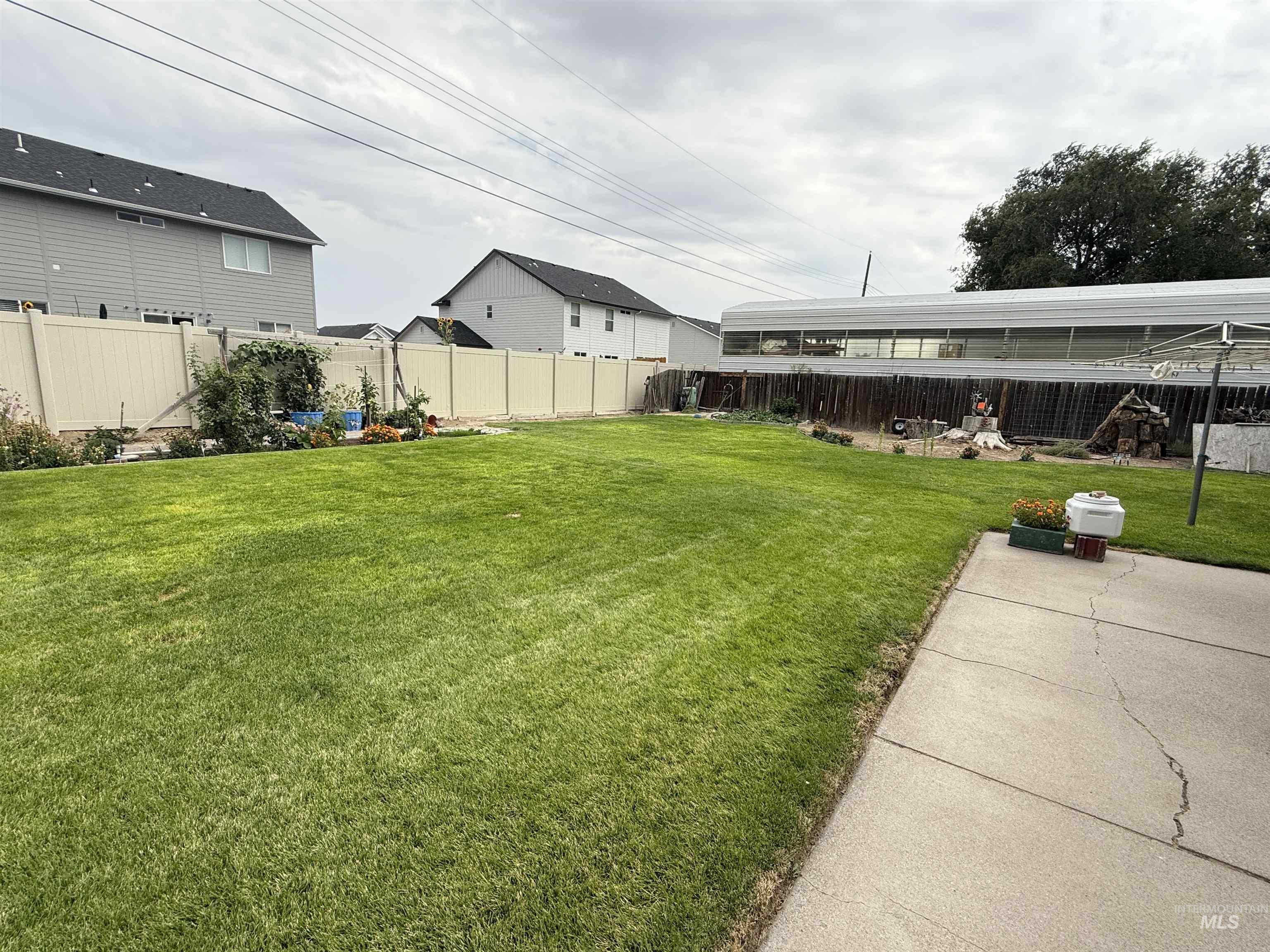 Fenced backyard with a patio area