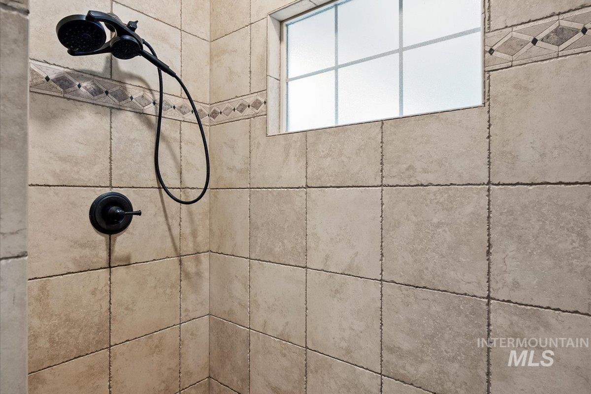 Bathroom view of a tile shower
