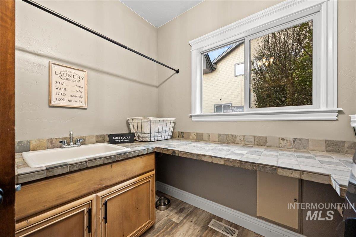 Featuring light wood-type flooring and vanity