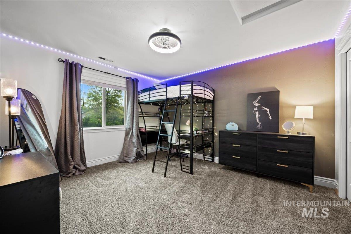 Bedroom with light carpet