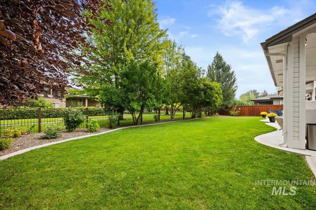 Fenced backyard with a patio area