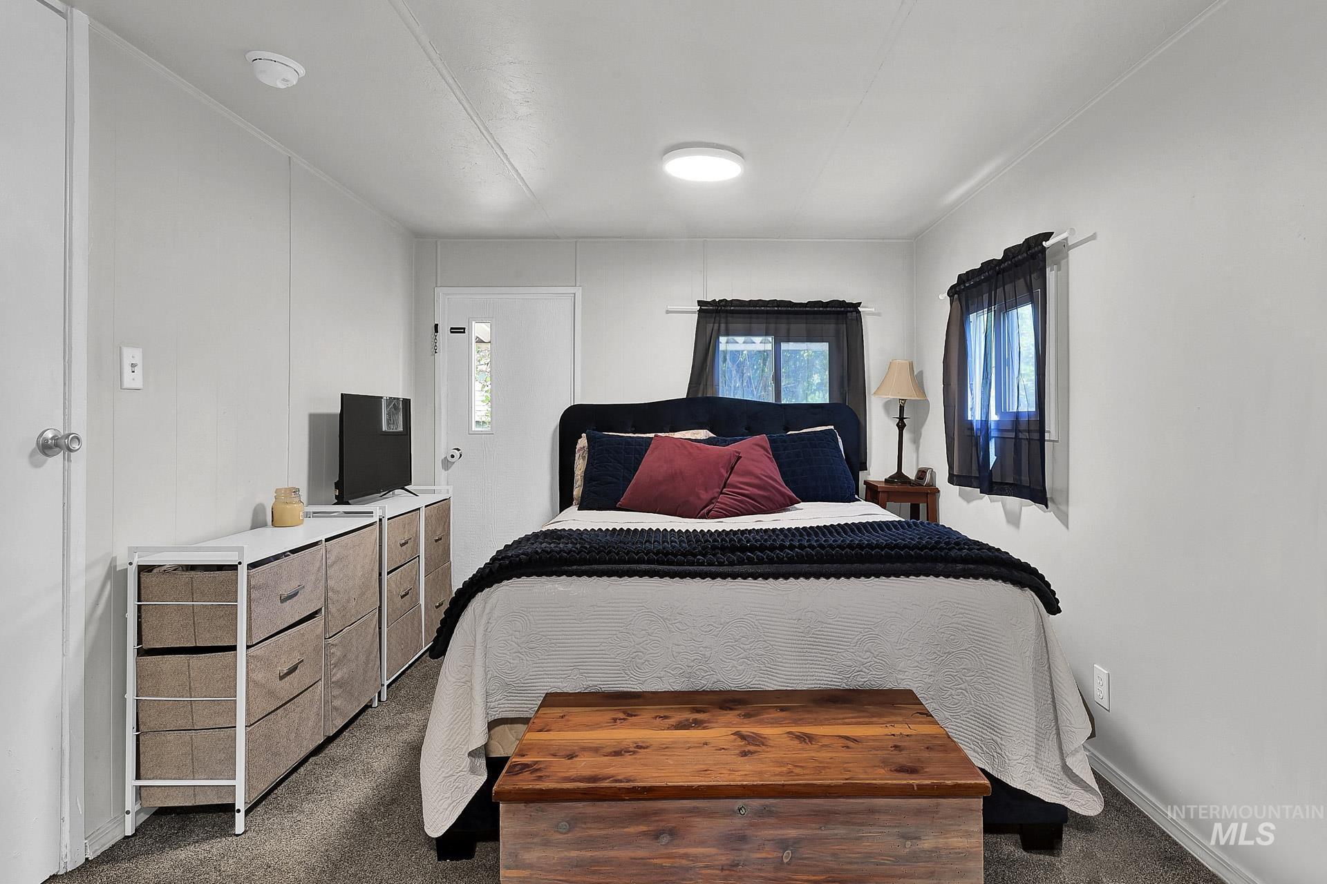 Bedroom with dark carpet