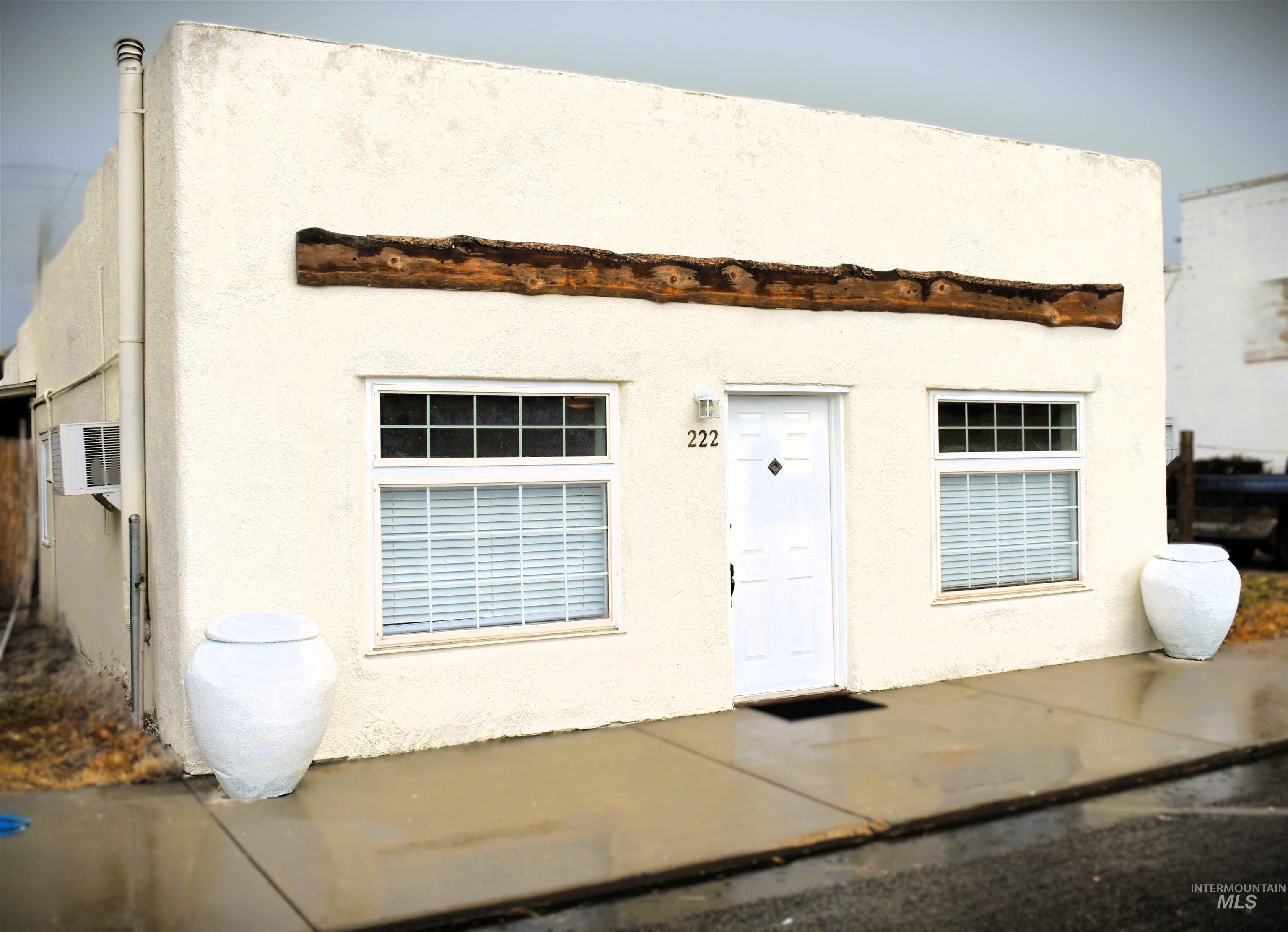 View of front of property featuring stucco siding