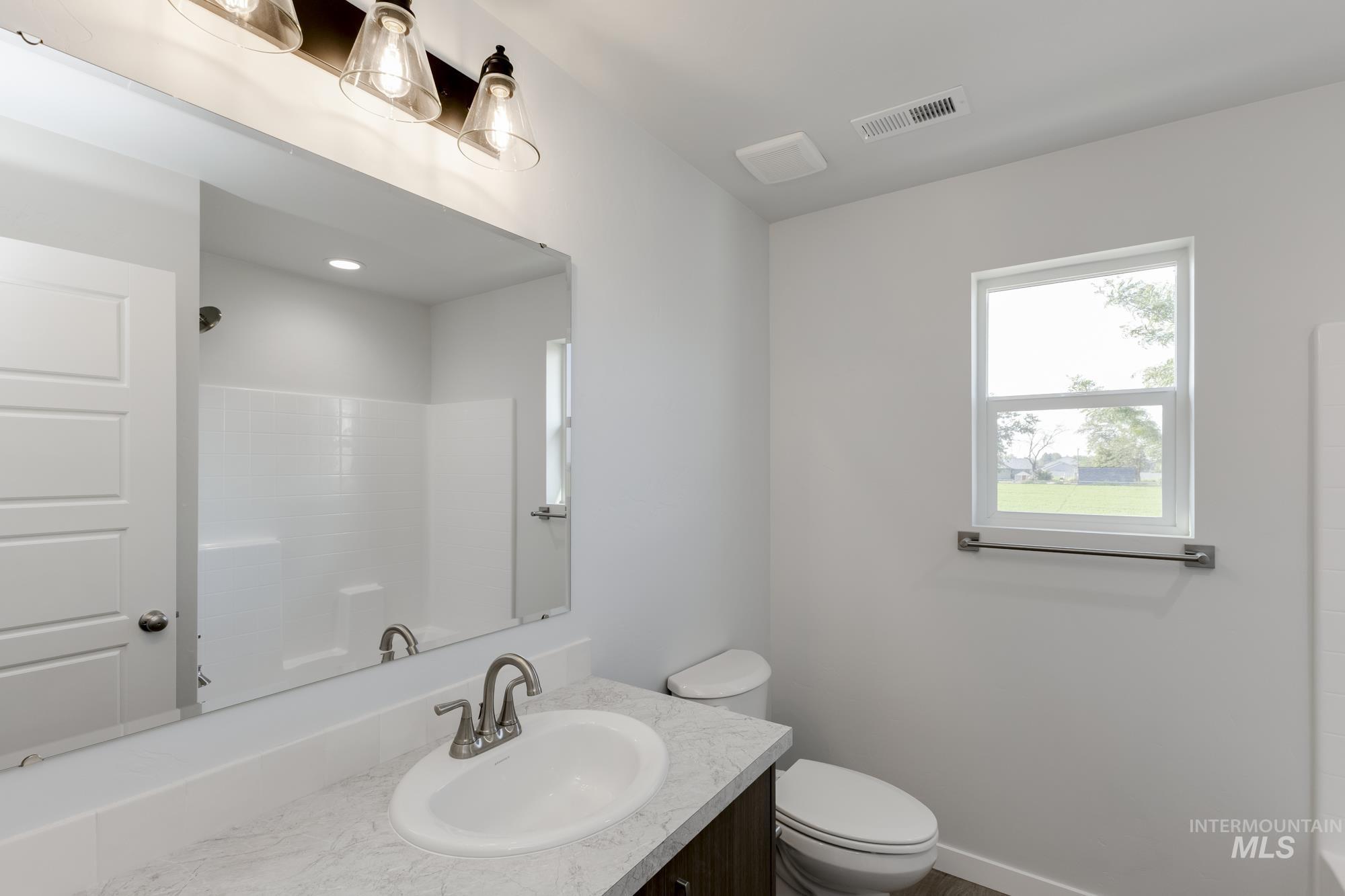 Full bathroom with vanity and shower / washtub combination