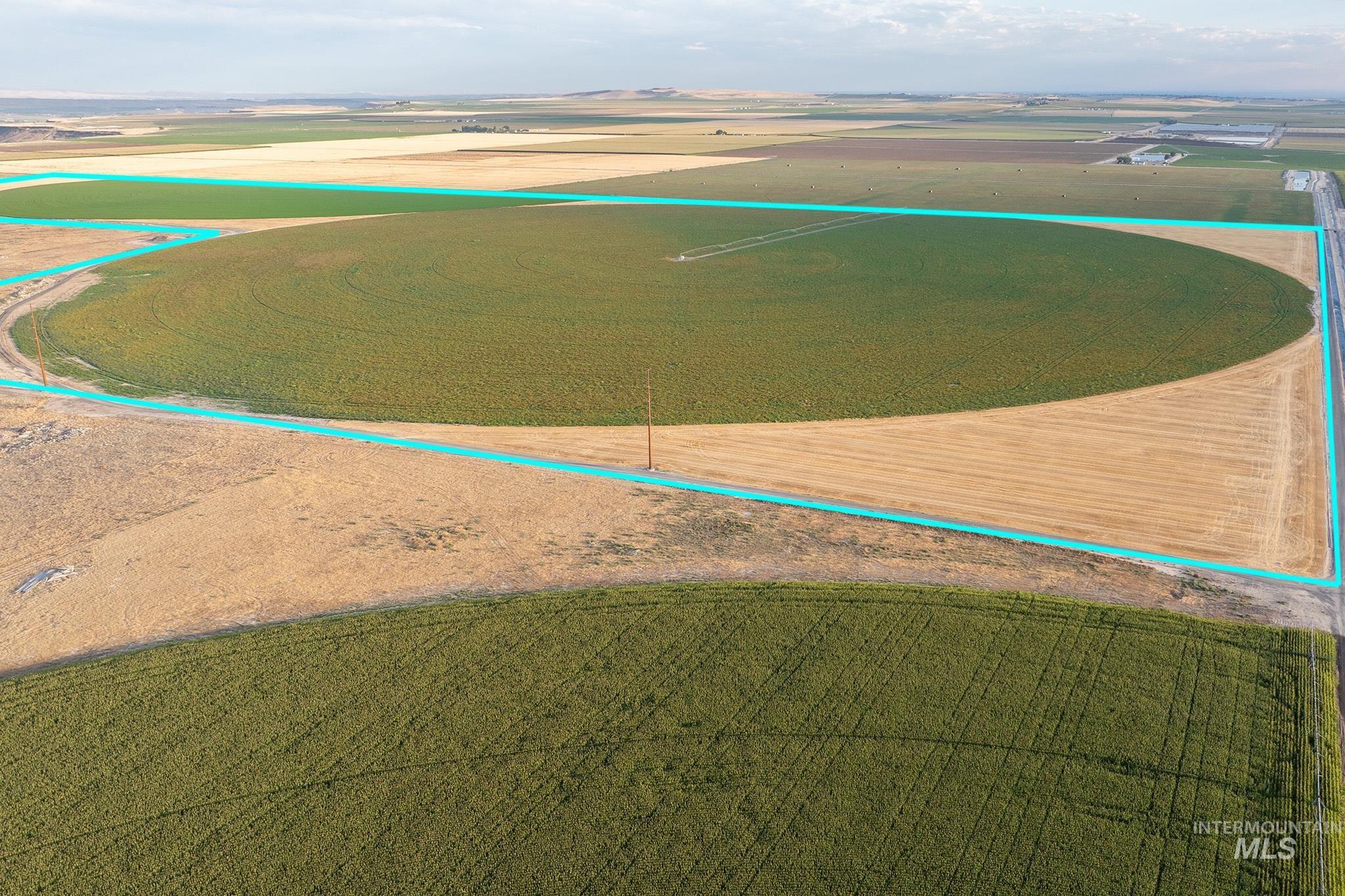 Aerial view of sparsely populated area featuring property parcel outlined